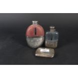 Two glass silver plated hip flasks together with a silver cigarette case with engraved decoration,