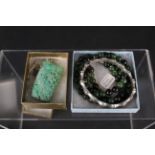 Mixed jewellery to include a carved jade brooch mounted in white metal,
