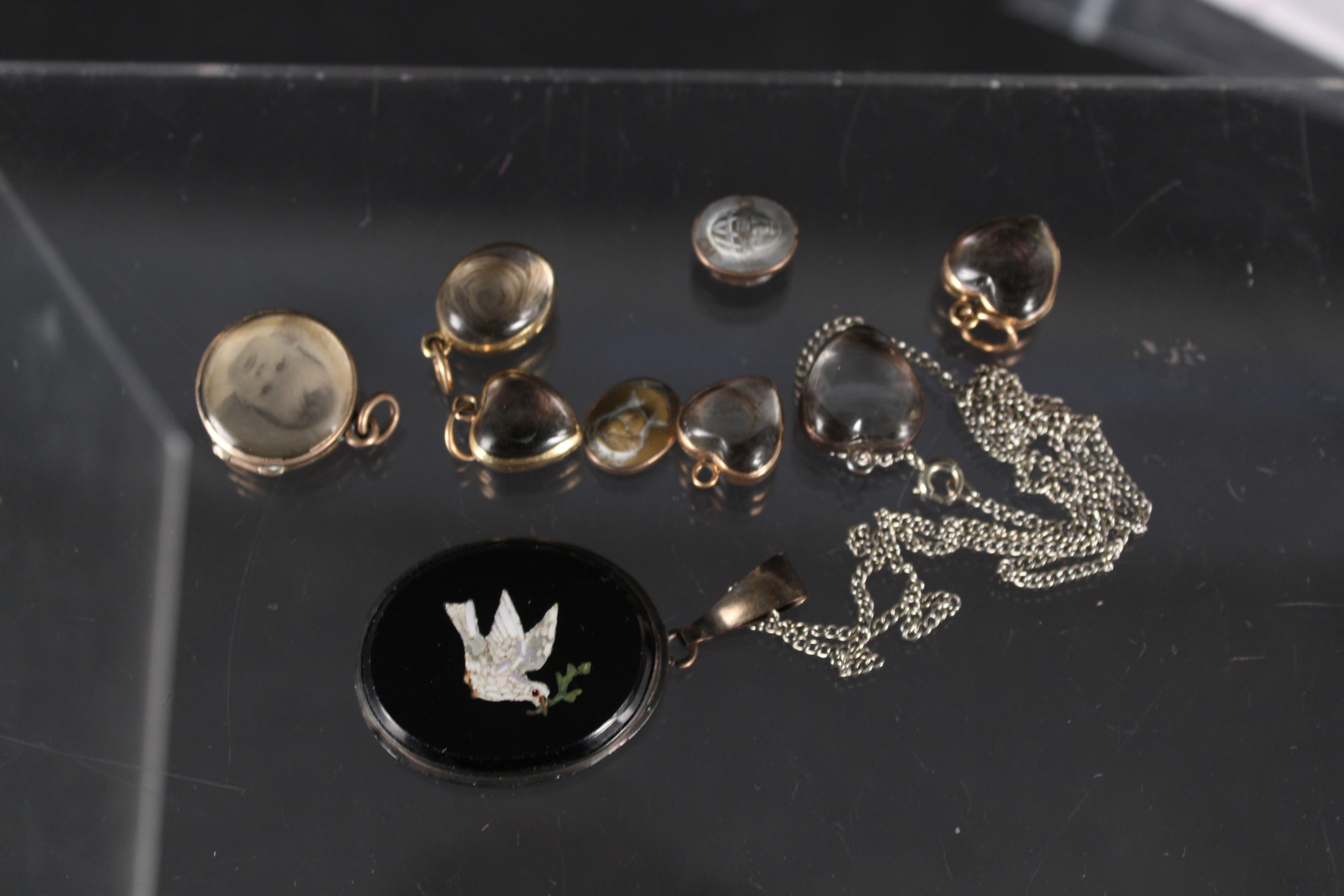 A collection of Victorian jewellery including six yellow metal mounted crystal set lockets,