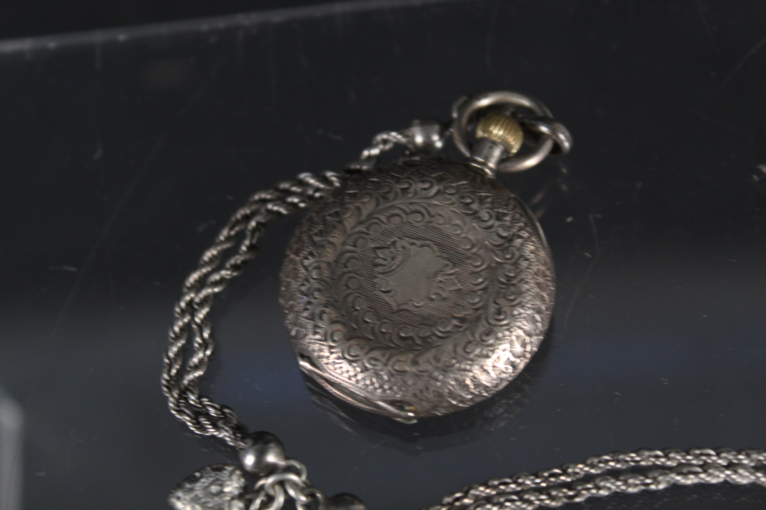 A continental lady's silver fob watch (lacking glass) with a white metal watch chain - Image 3 of 3