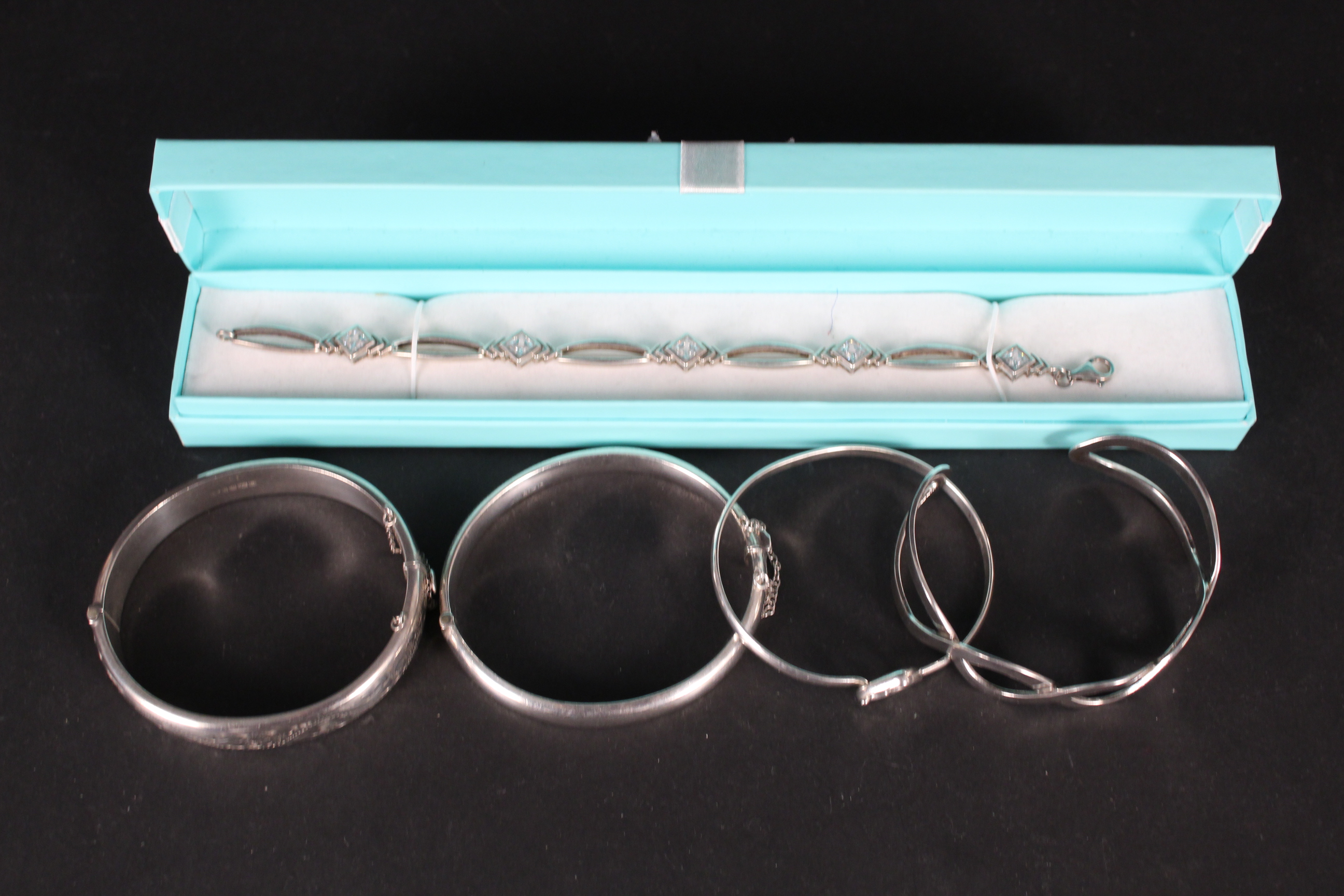 Five silver bracelets