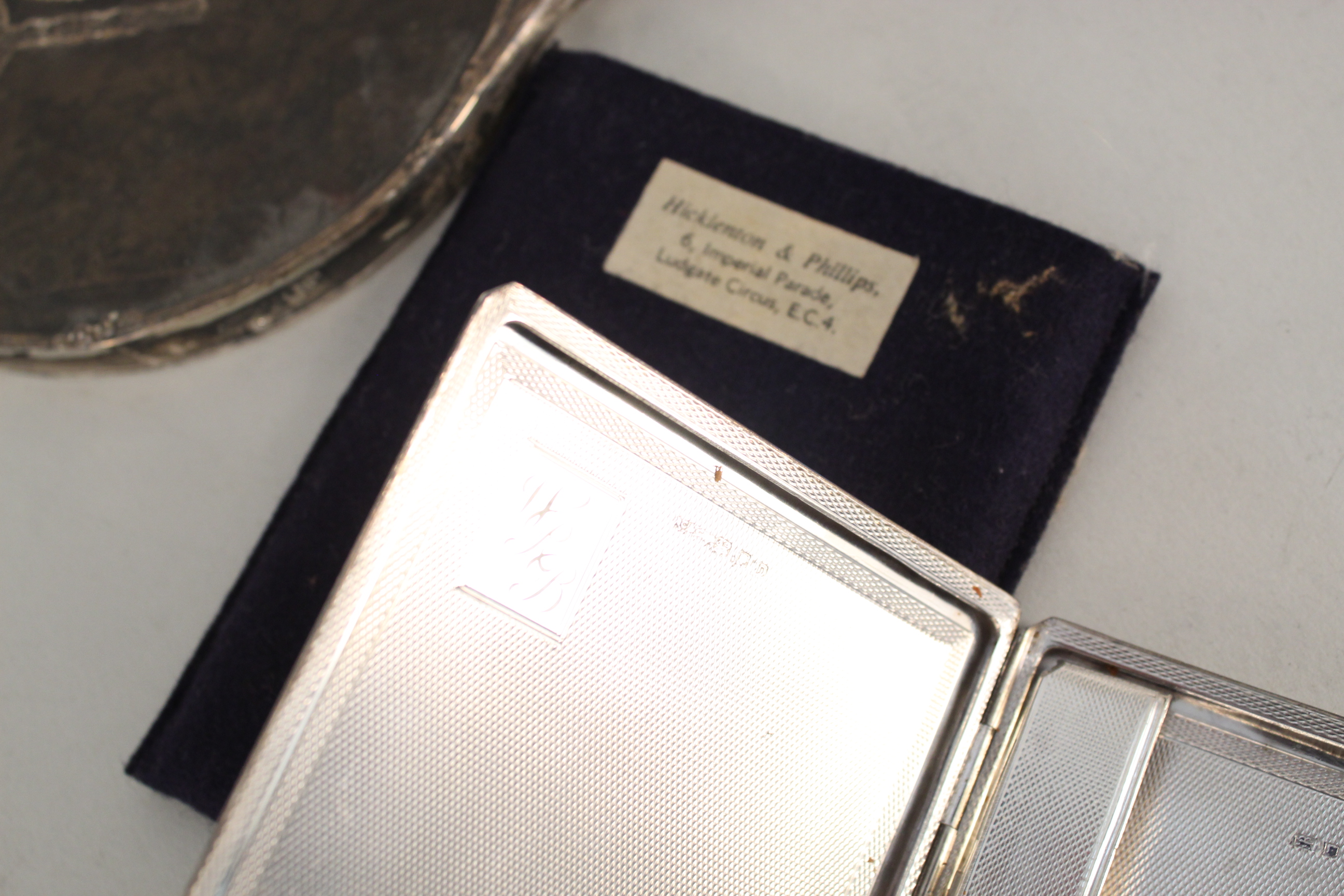 A silver and tortoiseshell hand mirror (as found) together with a silver cigarette case with engine - Image 2 of 6