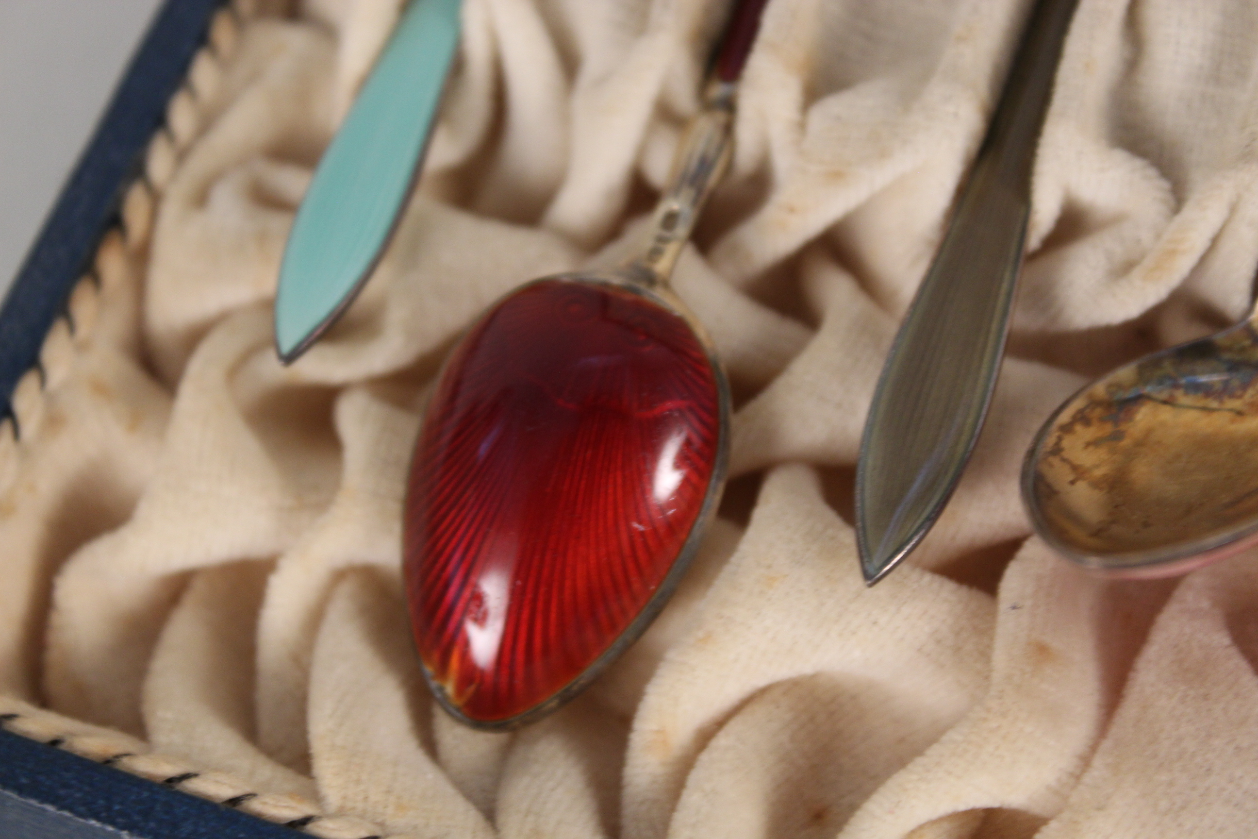 A cased set of six silver enamelled coffee spoons (slight damage to each spoon), - Image 5 of 5