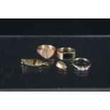 Three 9ct gold rings including onyx set, a 9ct gold boat charm plus a gold cap tooth,