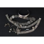 A silver plated belt with circular panels, embossed with female and male busts,