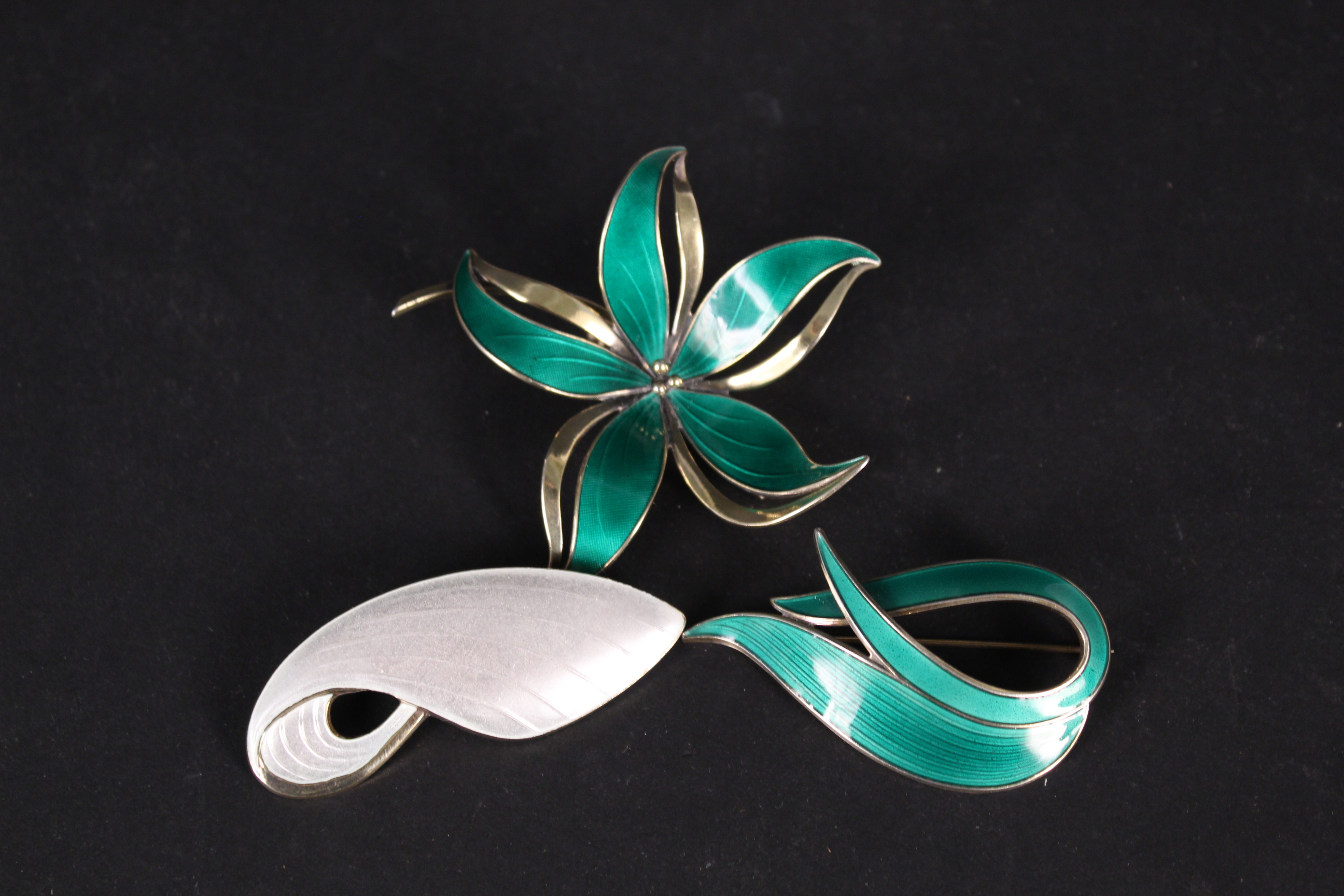 Three silver enamel brooches including Norwegian and Danish