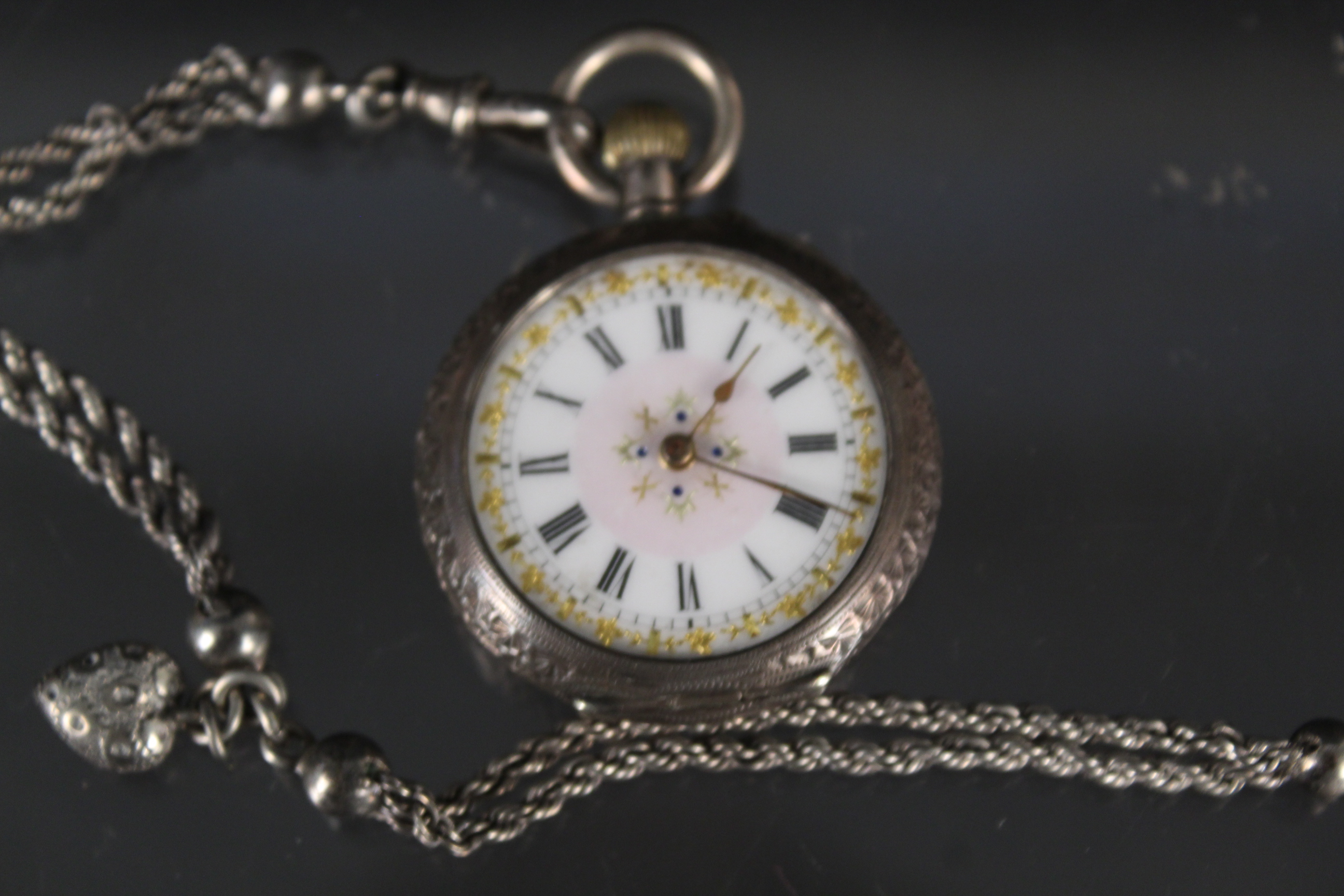 A continental lady's silver fob watch (lacking glass) with a white metal watch chain - Image 2 of 3