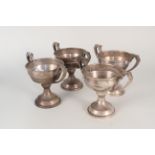 Four silver two handled trophy cups by Elkington & Co, all with presentation inscriptions,