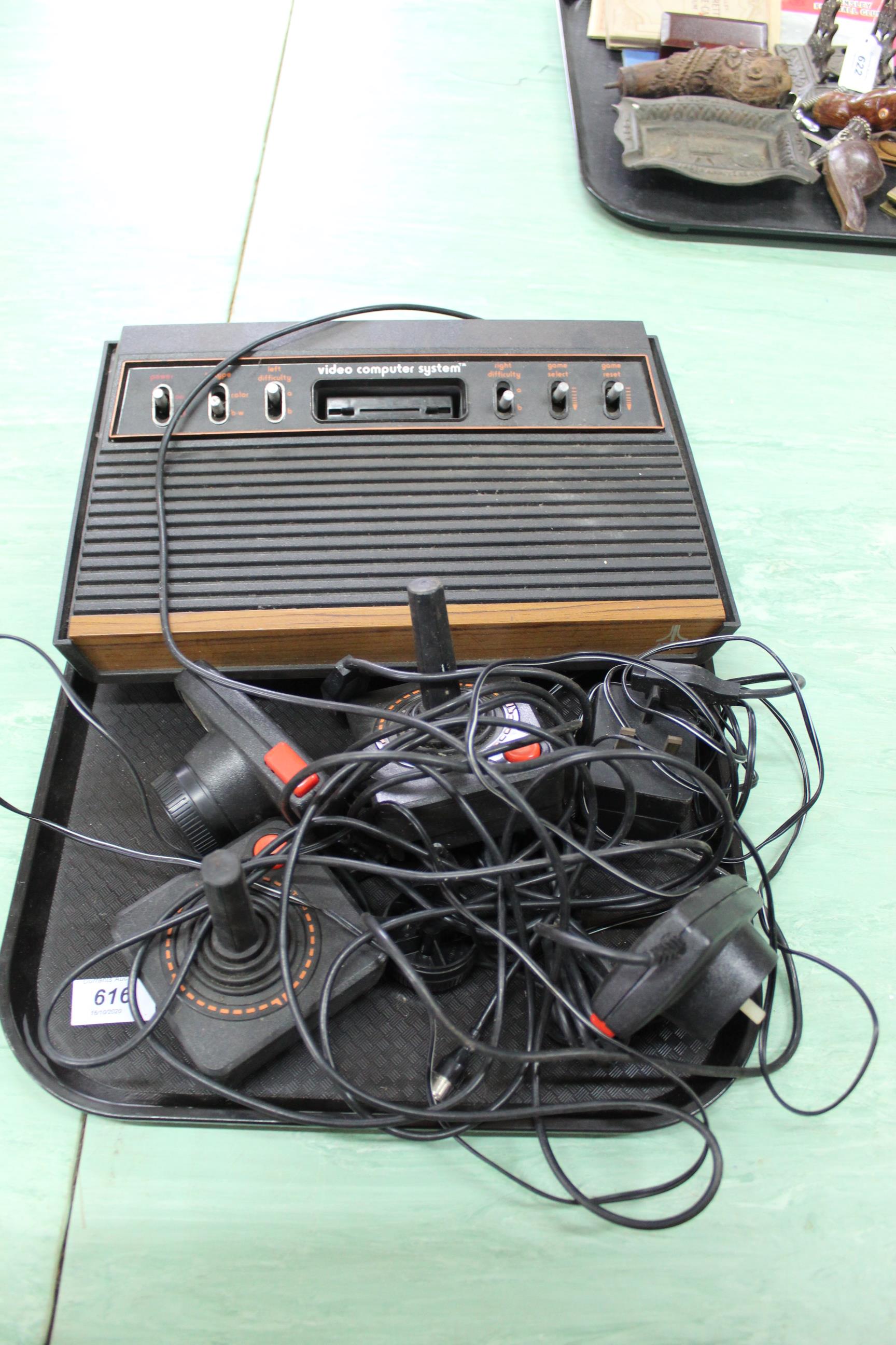 A vintage Atari CX-2600 video computer system with controllers