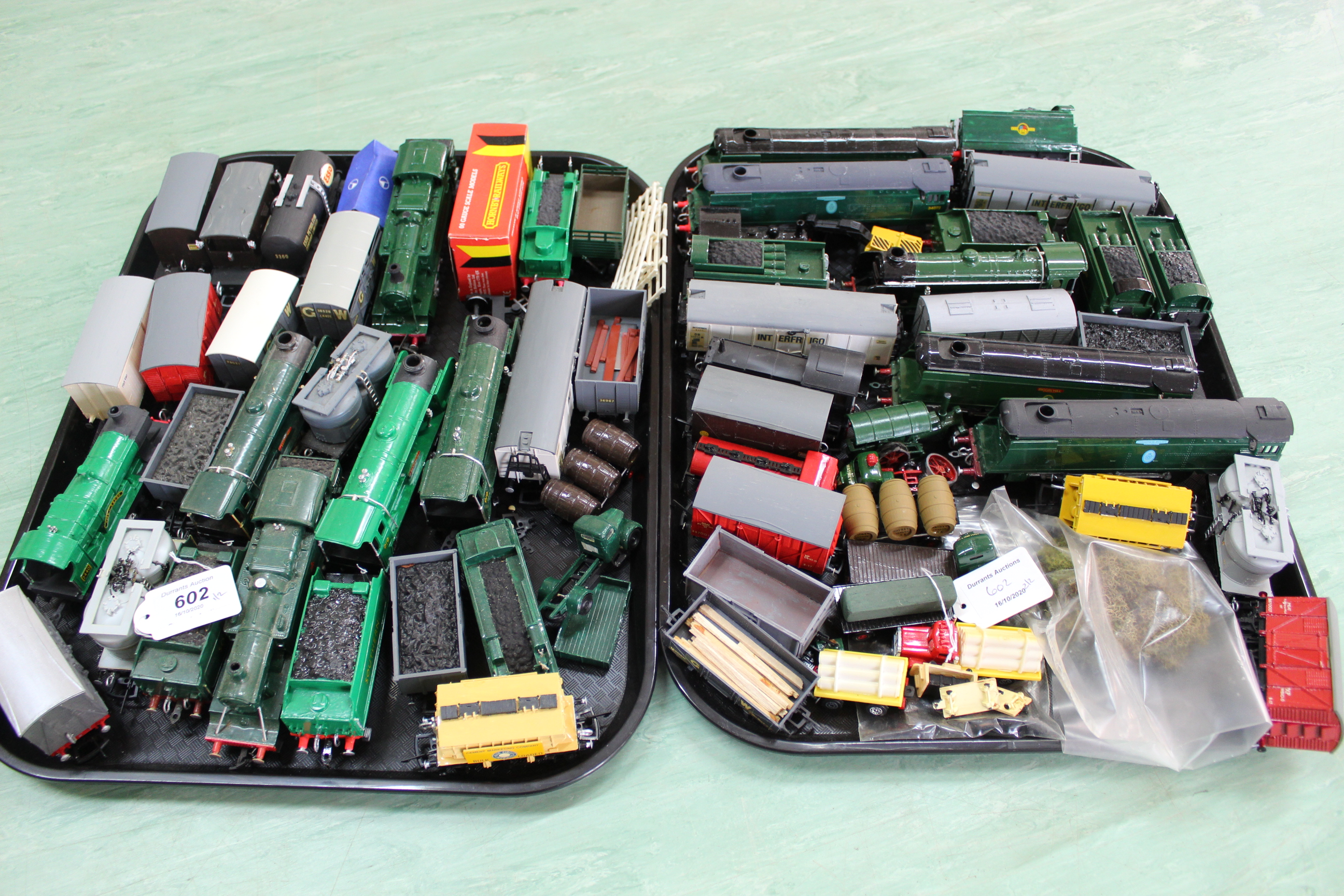 Two trays of plastic train engines,