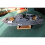 A scratch built motor torpedo boat, hand painted on stand,