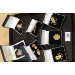 Five silver gilt Order of the British Empire pieces including cufflinks,