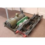 A vintage steam engine and accessories, approx 20" long with wheeled under carriage,
