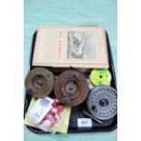 A collection of vintage fishing reels plus a bound copy of Sea Fishing by A E Cooper