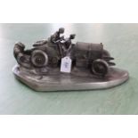 A pewter finish inkwell, study of a racing car after Wilhelm Zwick for Kayser, impressed signature,