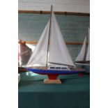 A scratch built pond yacht, rigged and ready to sail,