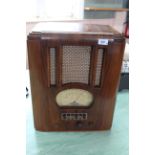 A vintage radio in a walnut veneered case,