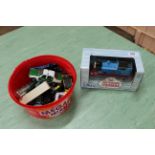 A boxed motorised Thomas the Tank Engine together with a tub of vintage Matchbox and Corgi cars