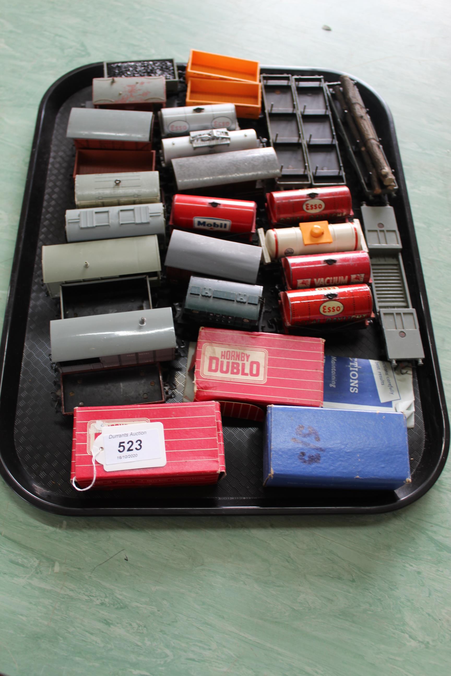 A tray of various Hornby Dublo wagons including advertising oil tankers and three empty boxes