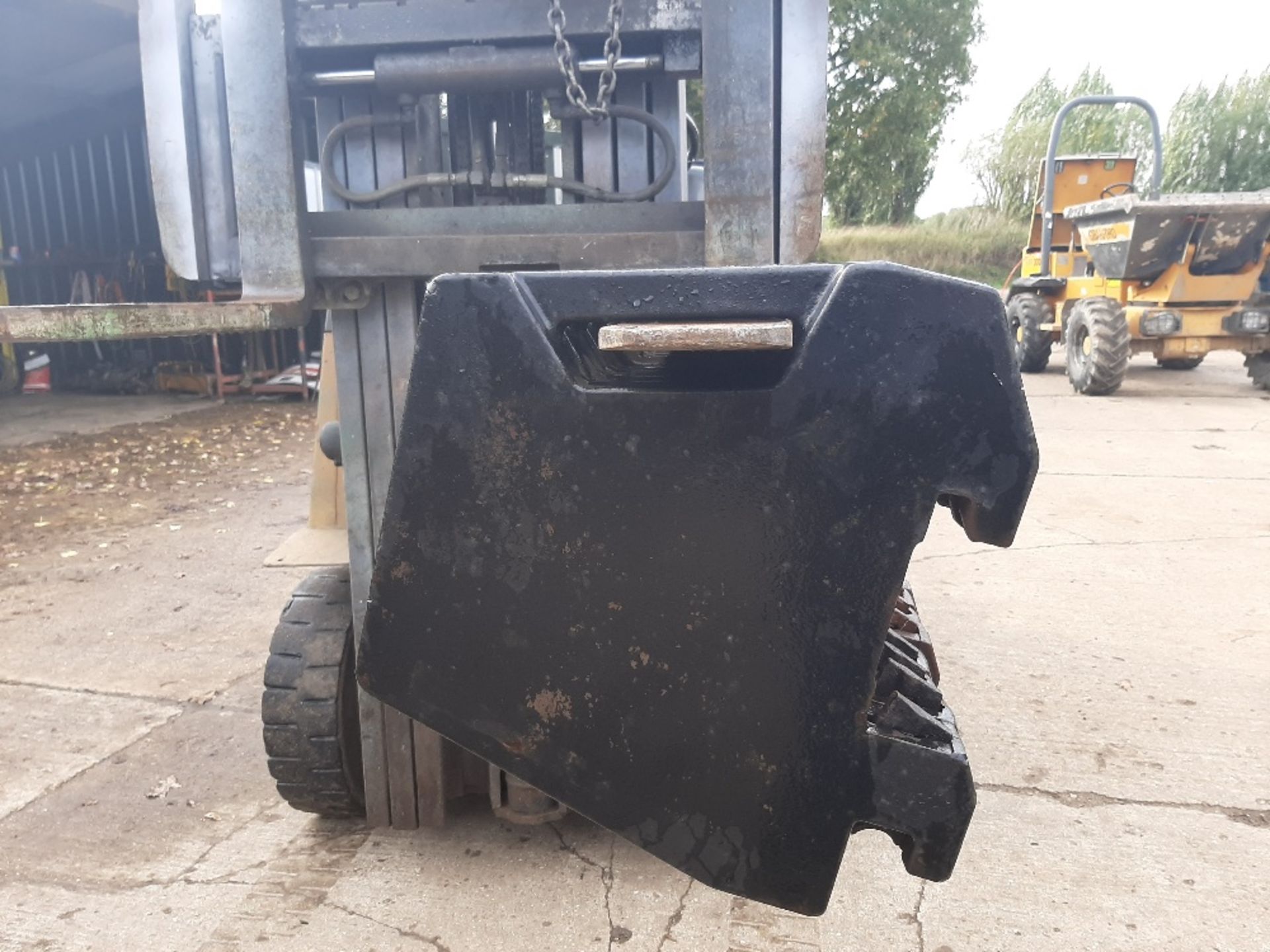 8 Massey weights 45 kgs each. Stored near Eye, Suffolk.