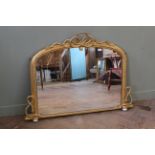 A 19th Century gilt overmantle mirror on porcelain feet with decorative rope design