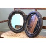 A pair of 19th Century reeded and gilt oval mirrors