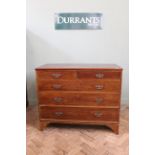 A George III mahogany chest of five drawers on splayed feet