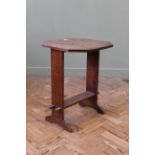 A 1920's oak folding drop leaf table