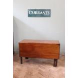 An Edwardian mahogany drop leaf table