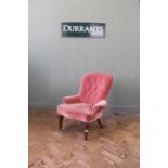 A Victorian pink upholstered mahogany nursing chair