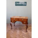 A good quality Georgian style four drawer lowboy on cabriole legs