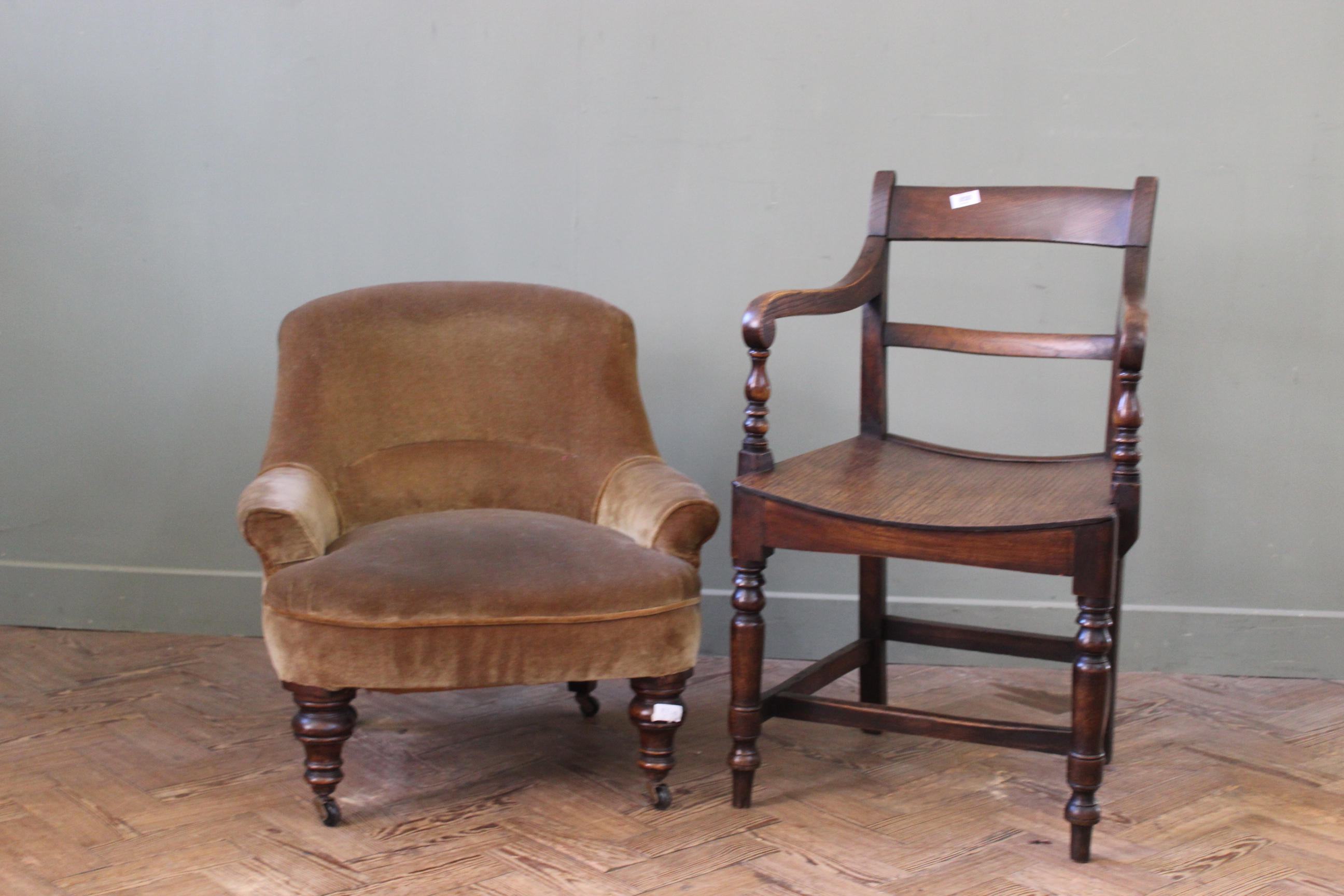 A Victorian nursing chair along with an oak and elm carver chair