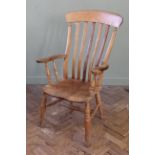 A late 19th Century beech and elm high back arm chair