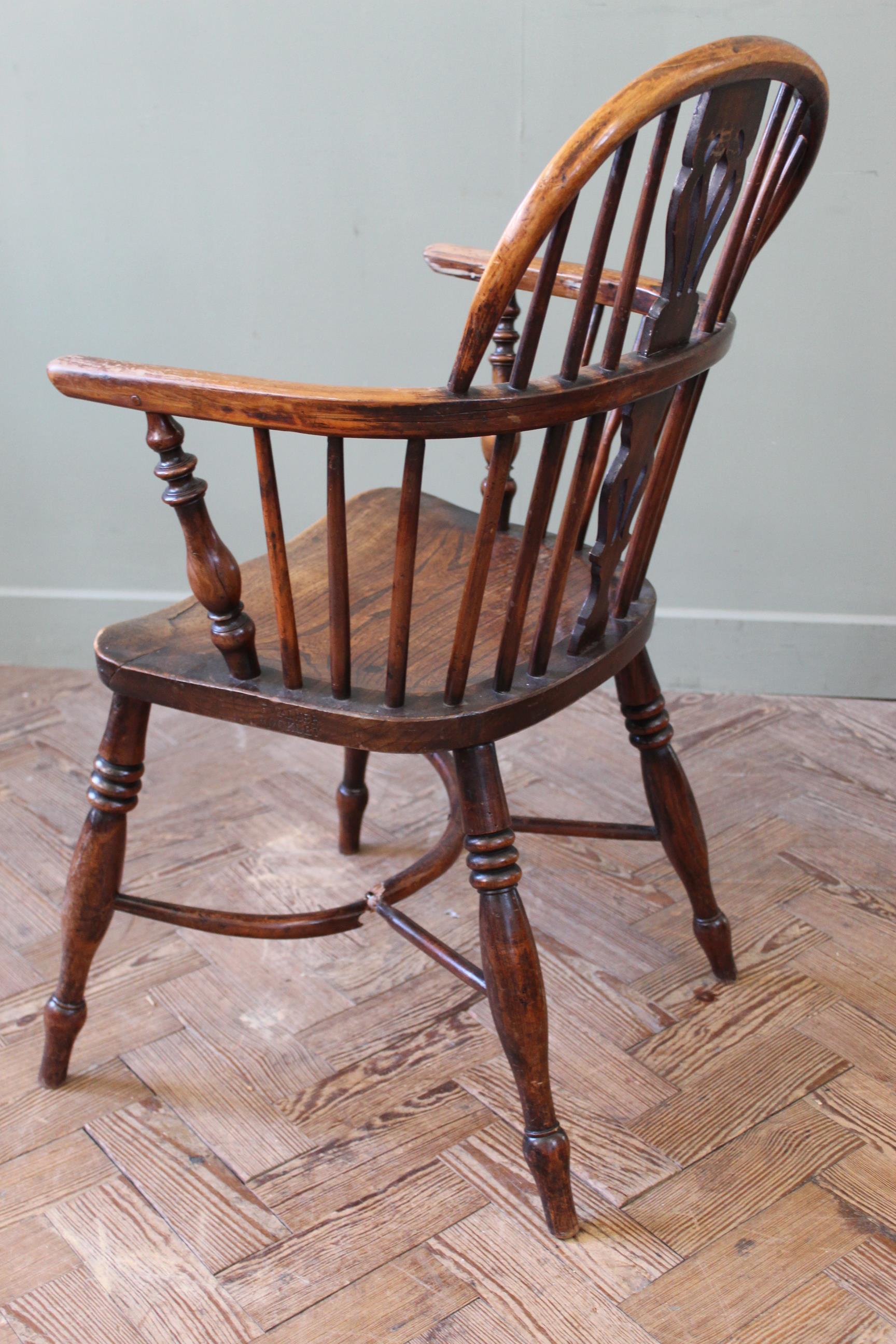 An early 19th century yew and elm Windsor chair stamped 'F. - Image 6 of 6