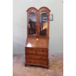 A Queen Anne walnut bureau with associated top