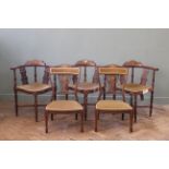 A set of three inlaid mahogany corners chairs and two low chairs