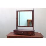 A 19th Century walnut three drawer toilet mirror with original brass finials and ivory knobs