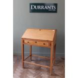 A Victorian pine desk with single drawer and fitted interior