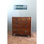 An early 19th Century mahogany five drawer chest with plate handles