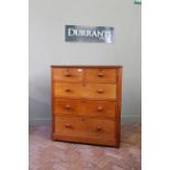 A late Victorian mahogany five drawer chest with turned mahogany knobs