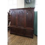 A George II oak six door hall cupboard