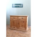A late Victorian pine two drawer,