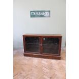 An Edwardian mahogany glazed two door bookcase