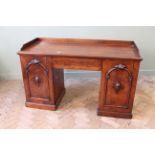 A mid Victorian mahogany desk with galleried upstand,