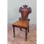 A Regency carved mahogany hall chair