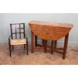 A 1920's Arts and Crafts oak gateleg table and an Edwardian child's chair