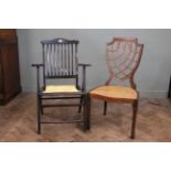 An Edwardian mahogany shield back dining chair and a mahogany folding chair