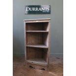 A late Victorian bleached pine corner cabinet with adjustable shelves