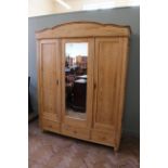 A late 19th Century pine triple breakdown wardrobe,