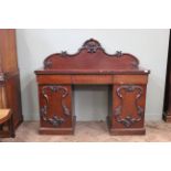 A Victorian mahogany three drawer pedestal sideboard